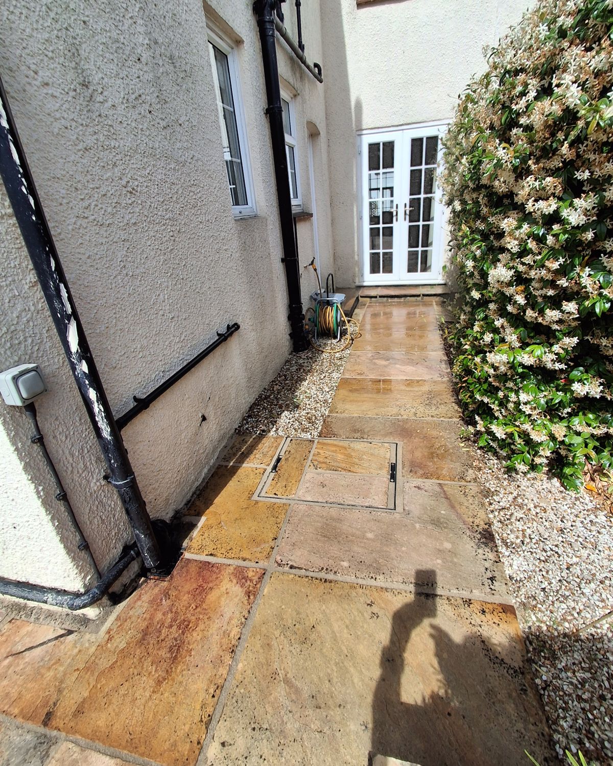 After: the same path with the recessed cover set in and every joint re-grouted
